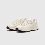 cream leather chunky lace-up dad sneakers in cream, front 45-degree view of the pair on a light gray background