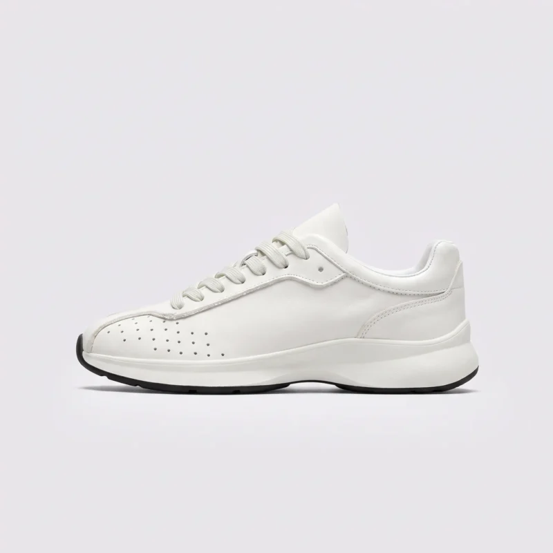 cream leather chunky lace-up dad sneakers in cream, left side profile view on a light gray background