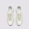 cream leather chunky lace-up dad sneakers in cream, top-down view of the pair on a light gray background