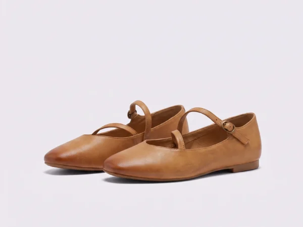 Pair of apricot AZEKA French-retro single-strap Mary Jane flats, soft flat sole, front 45 degree view on light gray background