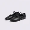 Pair of black AZEKA French-retro single-strap Mary Jane flats, soft flat sole, front 45 degree view on light gray background