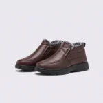 Pair of coffee brown AZEKA fleece-lined slip-on winter shoes with gray plush collar and thick cushioned sole, front 45 degree view on light gray background