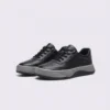 genuine leather casual sneakers breathable chunky sole in black, front 45-degree view of the pair on a light gray background