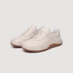 genuine leather casual sneakers breathable chunky sole in white, front 45-degree view of the pair on a light gray background