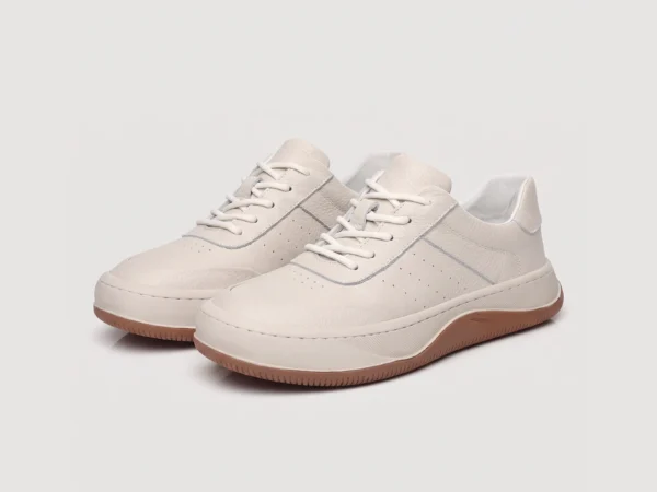 genuine leather casual sneakers breathable chunky sole in white, front 45-degree view of the pair on a light gray background