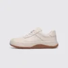 genuine leather casual sneakers breathable chunky sole in white, left side profile view on a light gray background