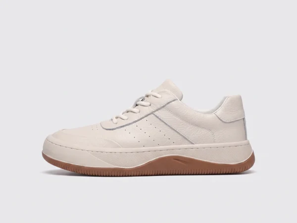 genuine leather casual sneakers breathable chunky sole in white, left side profile view on a light gray background