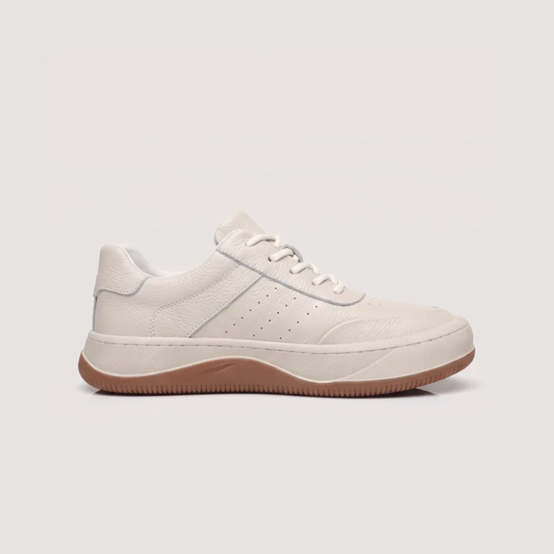 genuine leather casual sneakers breathable chunky sole in white, right side profile view on a light gray background