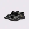 genuine leather men's beach slide sandals - soft sole thick platform outdoor wading slides in black, front 45-degree view of the pair on a light gray background