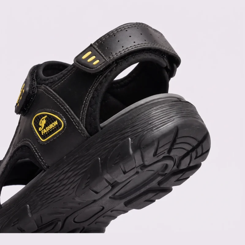 genuine leather men's beach slide sandals - soft sole thick platform outdoor wading slides in black, close-up view of the heel on a light gray background