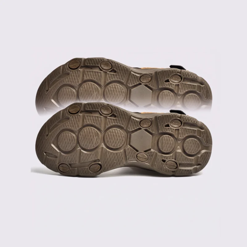 genuine leather men's beach slide sandals - soft sole thick platform outdoor wading slides in black, outsole tread view on a light gray background