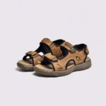 genuine leather men's beach slide sandals - soft sole thick platform outdoor wading slides in brown, front 45-degree view of the pair on a light gray background