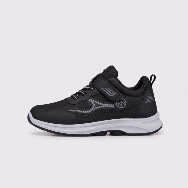 hook-and-loop walking sneakers slip-on soft sole non-slip comfort shoes for everyday walking in black, front 45-degree view of the pair on a light gray background