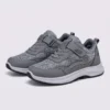 hook-and-loop walking sneakers slip-on soft sole non-slip comfort shoes for everyday walking in gray, front 45-degree view of the pair on a light gray background