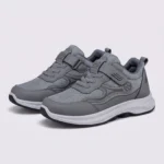 hook-and-loop walking sneakers slip-on soft sole non-slip comfort shoes for everyday walking in gray, front 45-degree view of the pair on a light gray background