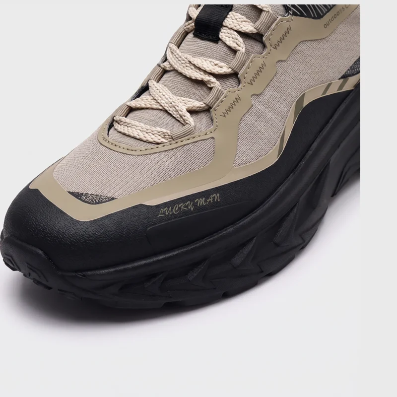 men's breathable chunky trail sneakers - lightweight hiking & casual walking shoes in khaki, close-up view of the toe on a light gray background