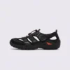 cut-out sport sandals - closed toe with hook-and-loop straps and a lugged rubber sole in black, left side profile view on a light gray background