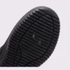 men's perforated mesh lace-up sneakers - thin summer walking shoes with a flex-groove sole in brown, close-up view of the heel on a light gray background