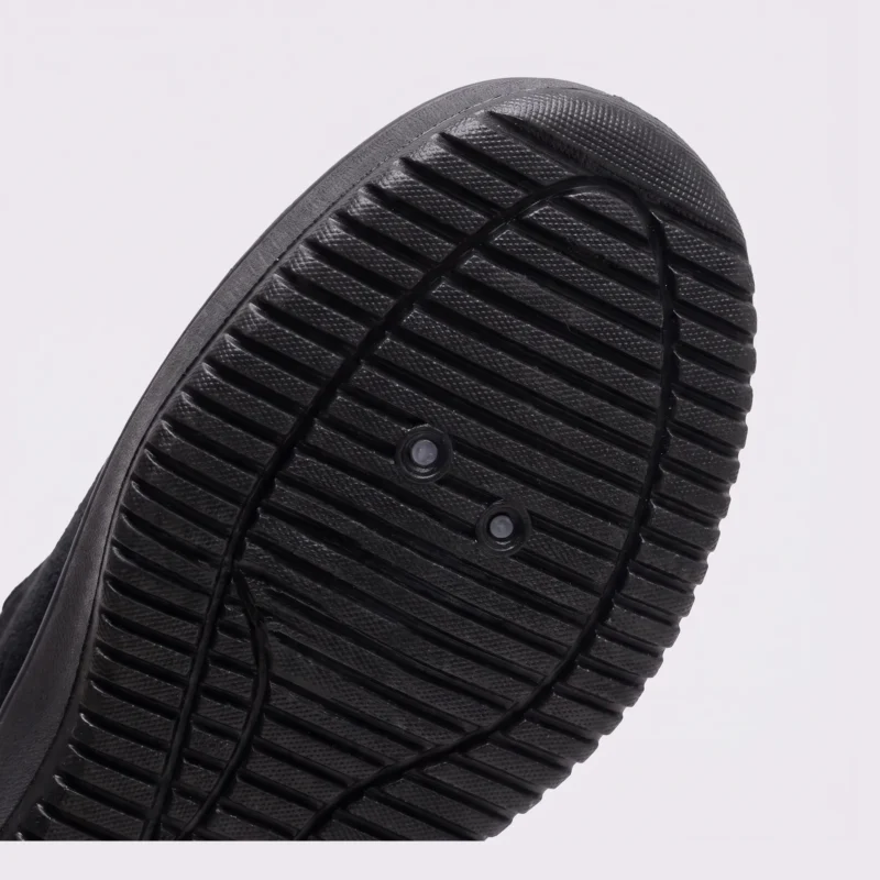 men's perforated mesh lace-up sneakers - thin summer walking shoes with a flex-groove sole in brown, close-up view of the heel on a light gray background