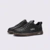 men's perforated slip-on sneakers - breathable knit casual walking shoes with cushioned sole in black, front 45-degree view of the pair on a light gray background