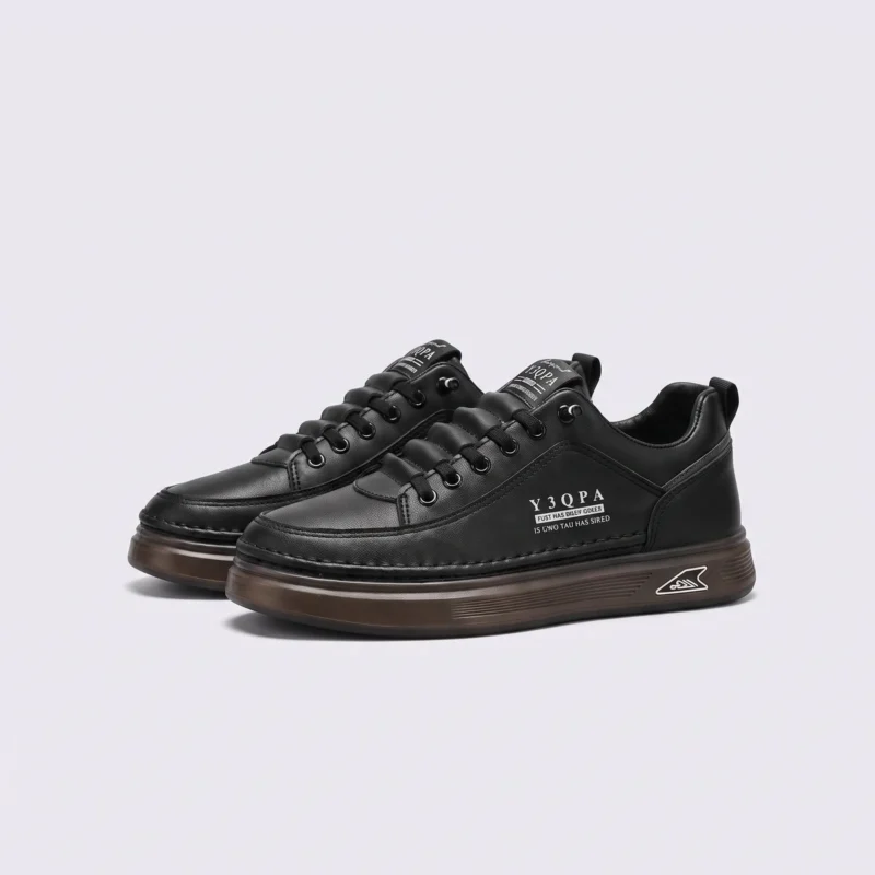 men's perforated slip-on sneakers - breathable knit casual walking shoes with cushioned sole in black, front 45-degree view of the pair on a light gray background