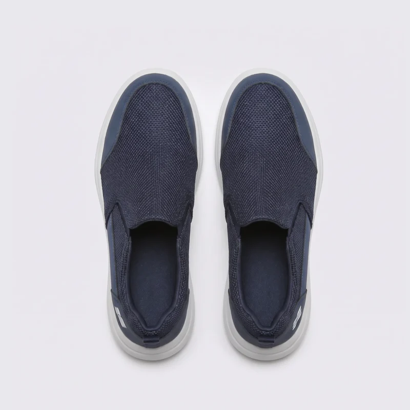 men's slip-on mesh casual sneakers - lace-free lightweight shoes with a cushioned thick sole in navy, top-down view of the pair on a light gray background