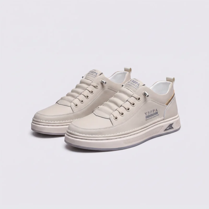 smooth-grain lace-up court sneakers - low-top casual shoes with a flat one-piece sole in beige, front 45-degree view of the pair on a light gray background
