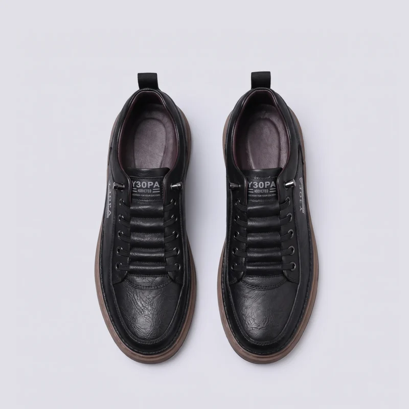 smooth-grain lace-up court sneakers - low-top casual shoes with a flat one-piece sole in black, top-down view of the pair on a light gray background