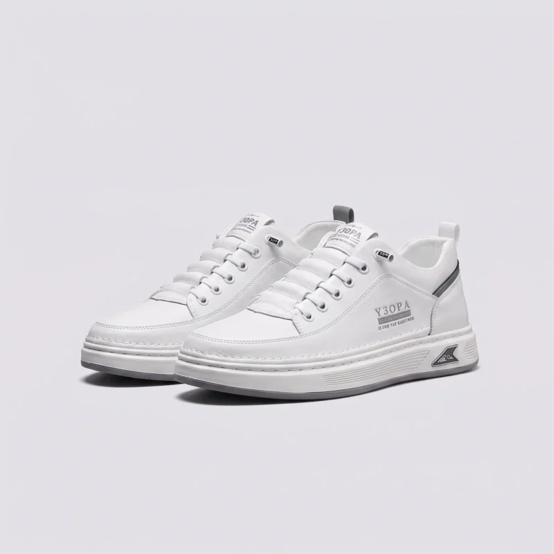 smooth-grain lace-up court sneakers - low-top casual shoes with a flat one-piece sole in white, front 45-degree view of the pair on a light gray background