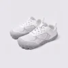 wide-toe knit trail sneakers - flexible thickened rubber outsole with a cushioned insole in white, front 45-degree view of the pair on a light gray background