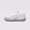 wide-toe knit trail sneakers - flexible thickened rubber outsole with a cushioned insole in white, left side profile view on a light gray background
