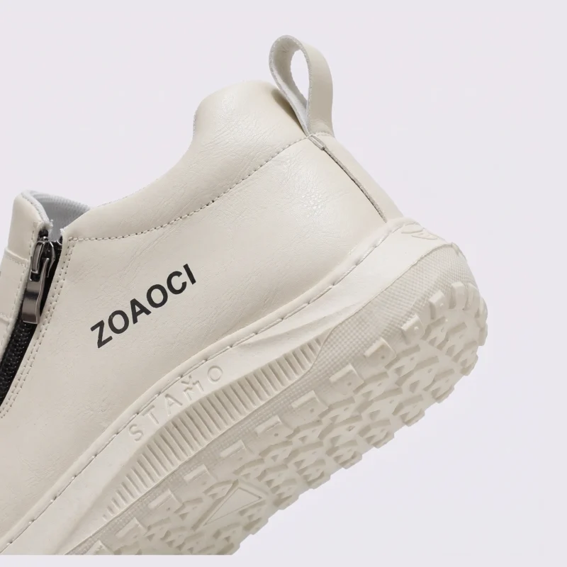 zip slip-on casual sneakers - lace-free smooth-upper shoes with a lugged thick sole in cream, close-up view of the heel on a light gray background