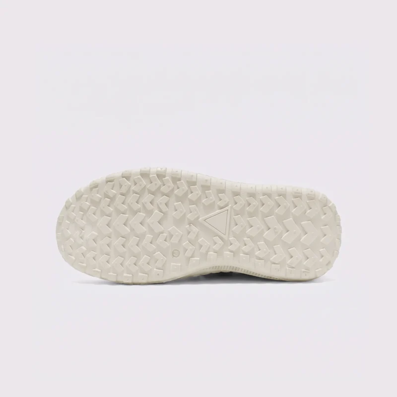 zip slip-on casual sneakers - lace-free smooth-upper shoes with a lugged thick sole in cream, outsole tread view on a light gray background