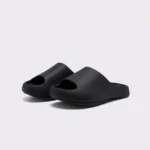 negative heel arch support slide sandals - thick platform one-piece eva slides for women in black, front 45-degree view of the pair on a light gray background