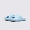 negative heel arch support slide sandals - thick platform one-piece eva slides for women, front 45-degree view of the pair on a light gray background