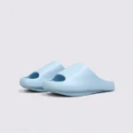 negative heel arch support slide sandals - thick platform one-piece eva slides for women, front 45-degree view of the pair on a light gray background