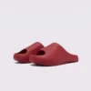 negative heel arch support slide sandals - thick platform one-piece eva slides for women in wine, front 45-degree view of the pair on a light gray background