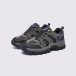 Pair of olive green AZEKA outdoor trail hiking shoes, front 45 degree view, thick black lug outsole on light gray background
