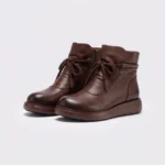 retro platform ankle boots chunky sole side zip warm fleece lined casual short boots in brown, front 45-degree view of the pair on a light gray background