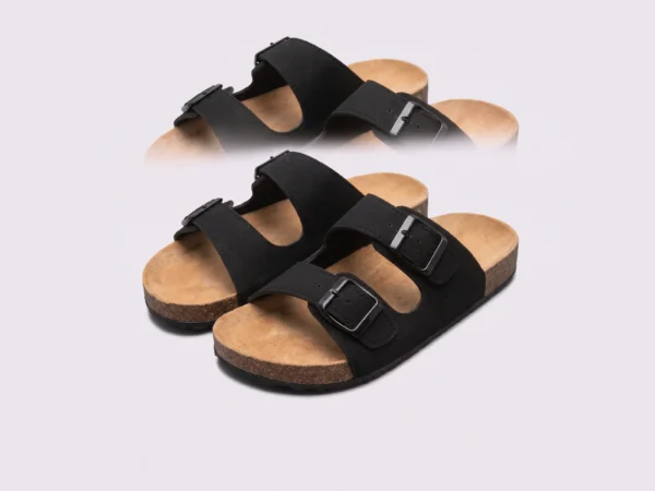 two-strap buckle casual sandals - adjustable double-strap slides with cushioned cork footbed for men and women in black, front 45-degree view of the pair on a light gray background
