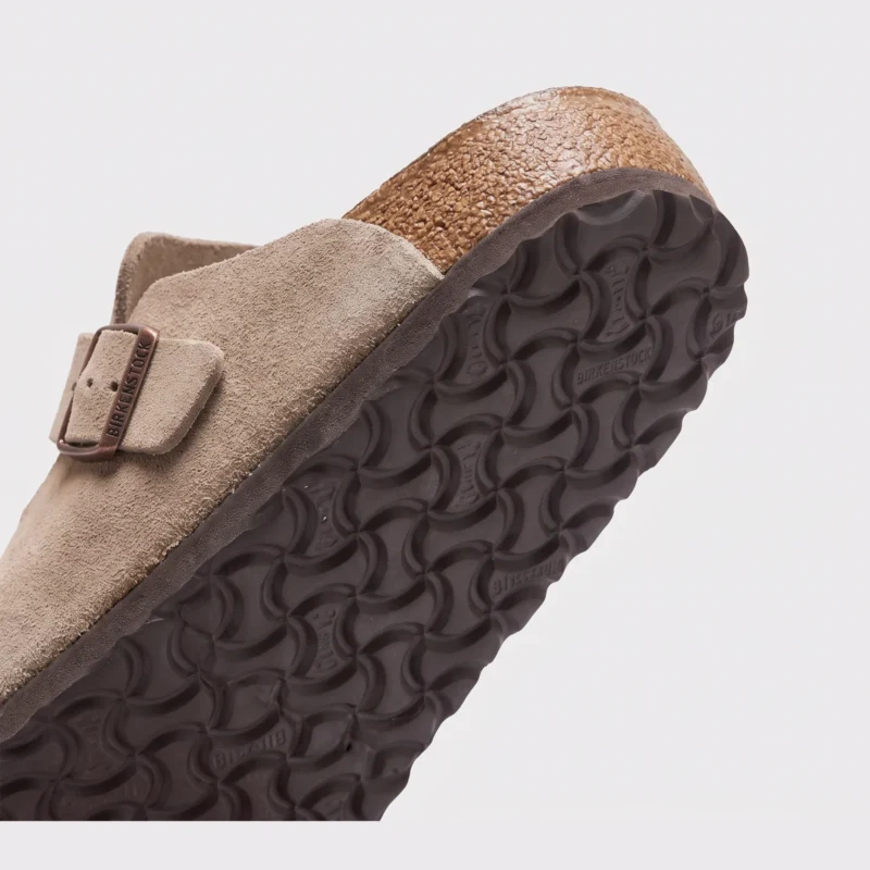 two-strap buckle casual sandals - adjustable double-strap slides with cushioned cork footbed for men and women in brown, close-up view of the heel on a light gray background