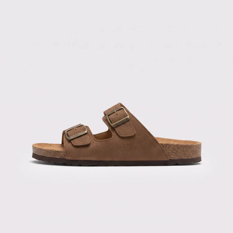 two-strap buckle casual sandals - adjustable double-strap slides with cushioned cork footbed for men and women in brown, left side profile view on a light gray background