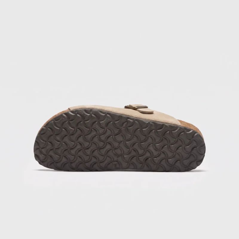two-strap buckle casual sandals - adjustable double-strap slides with cushioned cork footbed for men and women in brown, outsole tread view on a light gray background