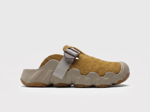 unisex wave-sole closed-toe clog slippers - suede slip-on mules with adjustable webbing strap and thick cushioned sole, left side profile view on a light gray background
