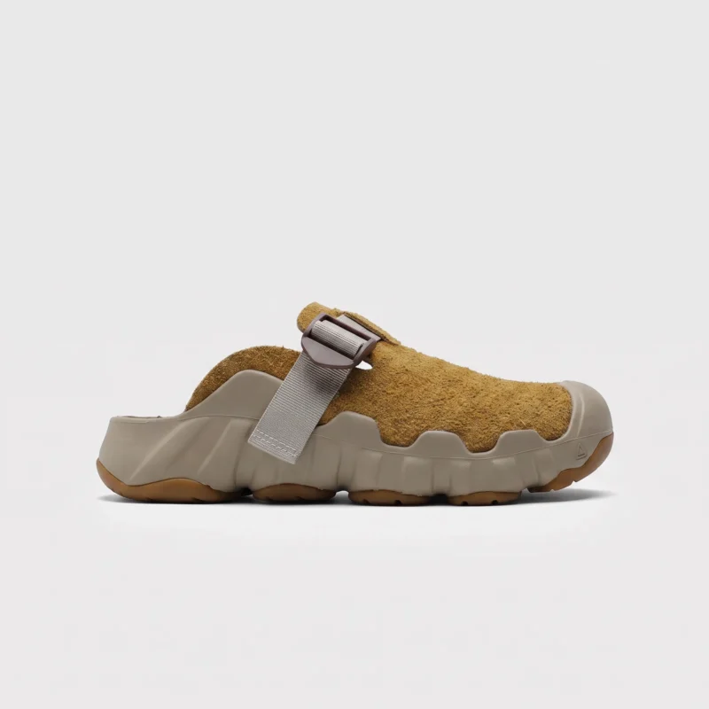 unisex wave-sole closed-toe clog slippers - suede slip-on mules with adjustable webbing strap and thick cushioned sole, left side profile view on a light gray background