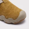unisex wave-sole closed-toe clog slippers - suede slip-on mules with adjustable webbing strap and thick cushioned sole, close-up view of the toe on a light gray background