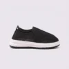 wide fit soft canvas slip-on shoes breathable mesh roomy toe everyday comfort in black, left side profile view on a light gray background