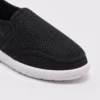 wide fit soft canvas slip-on shoes breathable mesh roomy toe everyday comfort in black, close-up view of the toe on a light gray background
