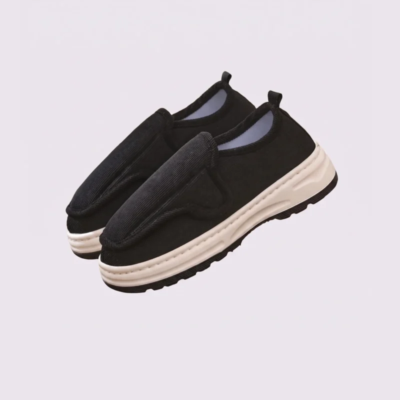 wide fit soft canvas slip-on shoes breathable mesh roomy toe everyday comfort, front 45-degree view of the pair on a light gray background