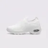 slip-on quilted sock sneakers - lace-free everyday shoes with a cushioned thick sole and heel window in white, left side profile view on a light gray background